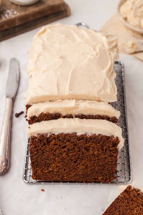 Discover the perfect recipe for a moist and flavorful Gingerbread Loaf that will become a staple during the holiday season. Topped with brown butter cream cheese frosting, and you have a copycat Starbucks gingerbread loaf recipe. Enjoying yourself, serve to guests, or give as a thoughtful homemade gift. Starbucks Copycat Gingerbread Loaf, Iced Gingerbread Loaf, Gingerbread Quick Bread, Copycat Starbucks Gingerbread Loaf, Gingerbread Loaf With Cream Cheese Icing, Holiday Loaf Recipes, Sourdough Gingerbread Loaf, Ginger Bread Loaf Recipes, Gingerbread Butter