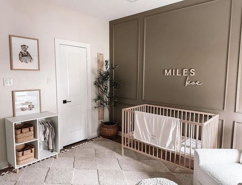 Boy nursery with personalized wooden name sign above crib Nursery Ideas Accent Wall Gender Neutral, Nursery Name Sign Above Dresser, Nursery Wall Board And Batten, Nursery Brown Walls, Cream Color Nursery, Taupe Accent Wall Nursery, Little Hunter Nursery, Nursery With Wall Molding, Boy Nursery With White Crib