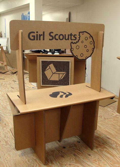 Cardboard Girl Scouts Cookie Booth Stand from Chairigami. Cookie Booth, Girl Scout Cookie Sales, Girl Scout Cookies Booth, Cardboard Chair, Pallet Display, Girl Scouts Cadettes, Cardboard Creations, Girl Scout Daisy, Girl Scout Activities