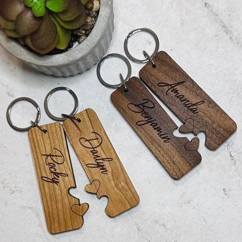 "These beautiful, solid wood keychains make a great gift for a couple.  Perfect for wedding, anniversary, Valentine's Day, or just to show the love between two people.  Keychains are custom cut and laser engraved.  Keychains are 1\" wide by 3\" long, made of 1/4\" solid hardwood.   Please choose type of wood, and add names (double check spelling and capitalization) in the personalization area. Due to the natural variations in wood, they may not appear exactly as shown in the listing photos." Wood Projects For Couples, Valentines Engraving Ideas, Laser Engraving Ideas Valentines, Valentines Day Laser Engraving Ideas, Valentine’s Day Wood Projects, Valentine's Day Laser Cut Gifts, Wood Valentines Gifts, Valentine Laser Ideas, Valentine’s Day Laser Projects