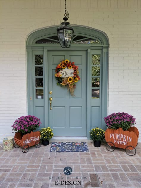 Kylie M Interiors Edesign talks about navy blue, red, blue green, gray, black and more! #edesign #kylieminteriors #kyliemedesign #exteriorpaint #frontdoor #curbappeal Front Door And Trim Painted Same Color, Blue Front Door With Sidelights, Blue Green Door Exterior, Agean Teal Front Door, Front Door Colors With Clay Color Siding, Black And White House With Colored Door, Pop Of Color Front Door, Colourful Front Doors, Front Door Colors With Gray Siding