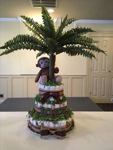 25+ Wonderful Jungle Themed Baby Shower Ideas Jungle Theme Diaper Cake, Baby Shower Jungle Theme, Baby Shower Monkey Theme, Tropisk Fest, Safari Baby Shower Decorations, Gender Neutral Baby Shower Themes, Wild Baby Shower, Safari Baby Shower Boy, Jungle Theme Baby Shower