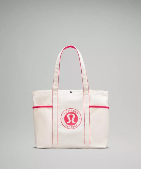 Daily Multi-Pocket Canvas Tote Bag 20L *Logo | lululemon SG Lululemon Bag, Lululemon Bags, Picnic Essentials, Canvas Tote Bag, Small Items, Easy Access, Canvas Tote, A Book, Snap Closure