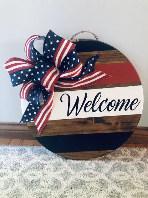 Round Signs Diy, Cricut Door Decorations, American Door Hanger, America Door Hanger, Red White And Blue Wood Crafts, Red White Blue Door Hanger, 4th Of July Round Wood Signs, Patriotic Door Sign, American Flag Door Hanger