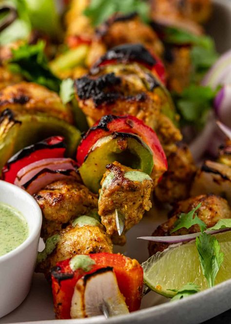 Chicken Tikka Kebab features pieces of spiced yogurt-marinated chicken skewered with peppers and onions. Make this recipe for delicious Indian chicken skewers on a grill or in your oven. #ChickenTikka #IndianChickenSkewers #TikkaKebab #IndianChickenRecipes Chicken With Peppers And Onions, Chicken Tikka Kebab, Chicken Peppers And Onions, Tikki Masala, Chicken With Peppers, Yogurt Marinated Chicken, Indian Chicken Recipes, Indian Chicken, Chicken Masala