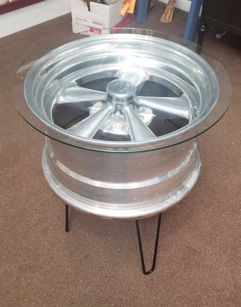 This is a 1970s Cragar S/S mag wheel rim repurposed into a man cave side table. Hairpin legs are attached to old wood. Wheel Table, Rustic Log Furniture, Car Rims, Welding Ideas, Masculine Decor, Car Part Furniture, Pin Legs, Automotive Furniture, Car Furniture