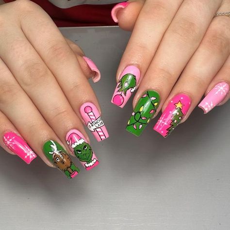 These long nails feature a vibrant pink and green color palette, decorated with the Grinch, his dog Max, and Christmas ornaments. Perfect for holiday enthusiasts, this design offers a fun, playful take on traditional Christmas nails. The Grinch Christmas Nails Acrylic, Grinch And Max Nails, Elf Movie Nails, Christmas Movie Nail Art, Fun Christmas Nail Art, Candyland Nails Designs, Multi Colored Christmas Nails, Green And Pink Christmas Nails, Grinch Nail Art Tutorial