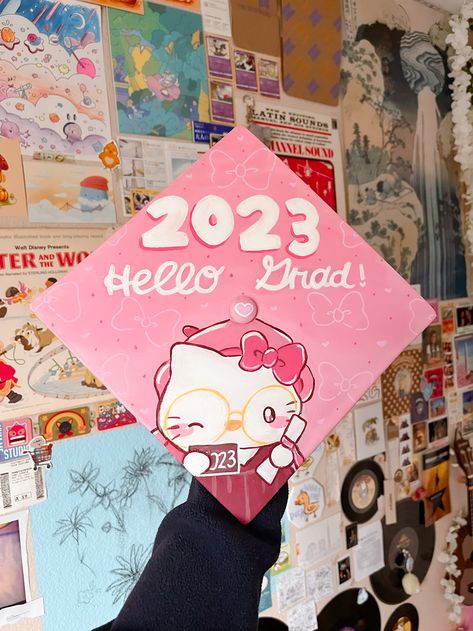 Grad Cap Hello Kitty, Painted Graduation Cap Ideas, Graduation Cap Designs Hello Kitty, Coraline Grad Cap, Senior Theme Ideas, Sanrio Graduation Cap, Graduation Cap Aesthetic, Graduation Cap Painting, Sanrio Graduation