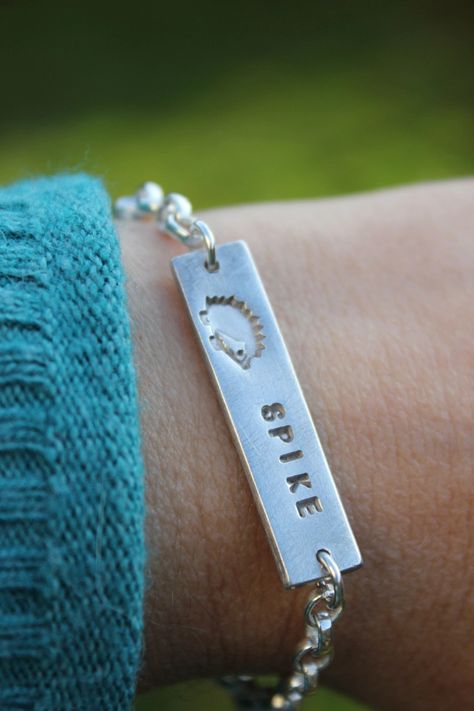 Hedgehog name bracelet. A cute silver hedgehog bracelet featuring any pet name. The name is hand embossed alongside the cute hedgehog. A great gift for any hedgehog lover and the proceeds support my hedgehog rescue work. Faux Suede Bracelets, Silver Bar Bracelet, Custom Charm Bracelet, Suede Bracelet, Hedgehog Gifts, Remembrance Jewelry, Memorial Bracelet, Bar Bracelets, Name Bracelet