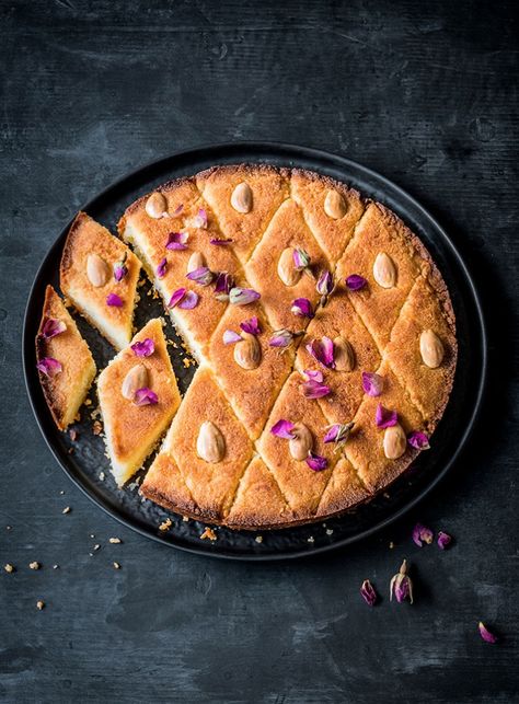 A dense semolina and coconut cake soaked in a fragrant rose water and orange blossom syrup, this Egyptian sweet treat is so easy to throw together. Basbousa Recipe, Recipes For Chicken, Ramadan Desserts, Caramel Treats, حلويات عربية, Mince Recipes, Creamy Potato, Favourite Food, Dessert Dishes