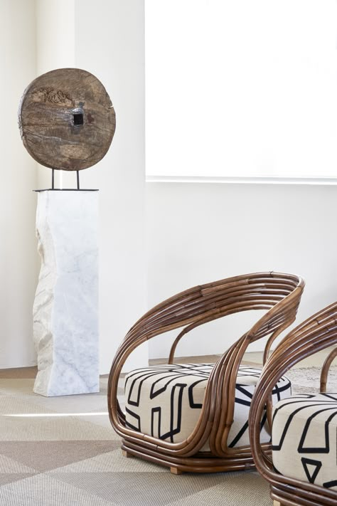 The Special Edition of Eva armchair in Malacca represents the quintessence of the softness and organicity of natural material. In the variant with skin, the warm colour of rattan creates a direct connection to the natural world. Starring Special Edition of Eva armchair by Giovanni Travasa, 1965. Enquiries for the unique pieces via email at info@bonacina1889.it Rattan Armchair Living Room, Curved Rattan Cabinet, Flower Rattan Chair, Rattan Butterfly, Black And Gold Living Room, Flora Rattan Pendant, Gold Living Room, Rattan Armchair, Interior Design Mood Board