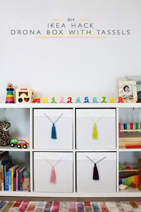 A simple IKEA Hack - add tassels to your plain drona boxes to give them a colourful pop and flair! These IKEA Hack drona boxes with tassels are super easy. Ikea Nursery Hack, Mod Living Room, Ikea Hack Kids, Nursery Hacks, Ikea Nursery, Eco Furniture, Hacks Ikea, Easy Ikea Hack, Ikea Hack Ideas