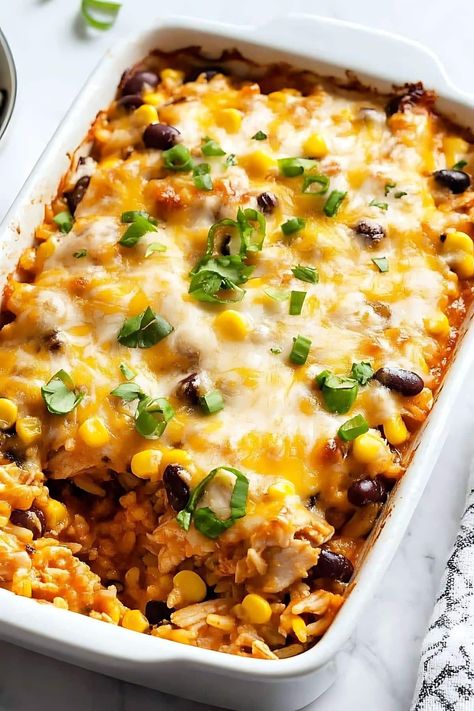 This Southwest chicken casserole is easy, cheesy, and delicious! It's full of tender chicken, rice, beans, corn, plus gooey cheese and yummy toppings. Couscous Casserole, Rice Beans Corn, Southwest Chicken Casserole, Southwest Chicken And Rice, Chicken Rice Beans, Casseroles Chicken, Cheesy Chicken Recipe, Easy Casseroles, Mexican Food Dishes