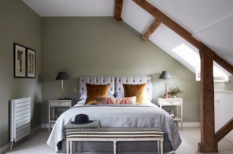 Designed with a bachelor in mind for this attic bedroom in a Georgian rectory.We painted the walls in a sage green colour from Farrow and Ball in this north-facing attic bedroom, with plenty of light and space, to create a cosseting feel.We used complementary colours to the green for the accessories,gold velvet for the pair of cushions and amber and russet in an embroidered fabric for the bolster.Combined they finish off the room by adding a richness whilst still keeping the calmness of the room Loft Room, Luxury Furniture Brands, H Design, Attic Bedroom, Loft Conversion, Design Bedroom, Guest Bedrooms, Top 50, Bedroom Colors