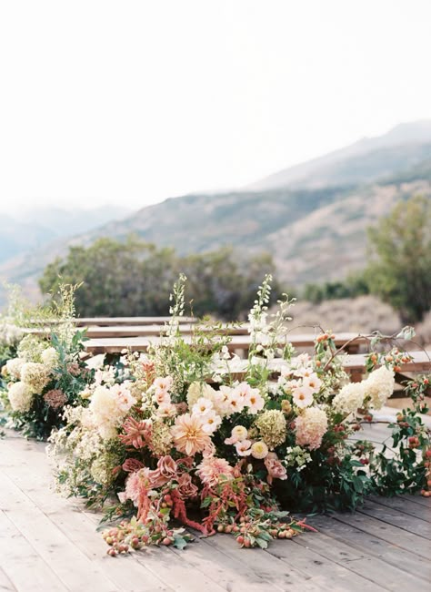 This Couple Mixed the Mountains with Elegant Glamour at Their Micro Wedding in Utah Petals Ceremony Aisle, Spring Meadow Wedding, Elegant Autumn Wedding, Flower Meadows Wedding, Wedding Ground Florals, Wedding In Field, Floral Aisle Wedding, Wedding Ceremony Florals Ground, Grounded Florals Wedding Ceremony