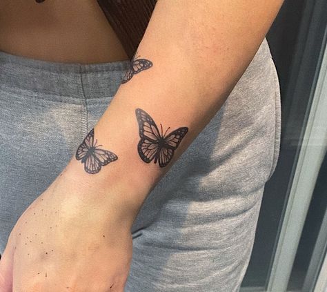 Butterfly Around Wrist Tattoo, Tattoo Forearm Butterfly, Flower Sleeve With Butterfly, Tattoo Ideas Female Wrist Butterfly, Butterfly Lower Arm Tattoo, Butterfly Tattoo Wrapped Around Wrist, Butterflies Around Wrist Tattoo, Forarm Butterflies Tattoo, Butterfly Wrist Wrap Tattoo