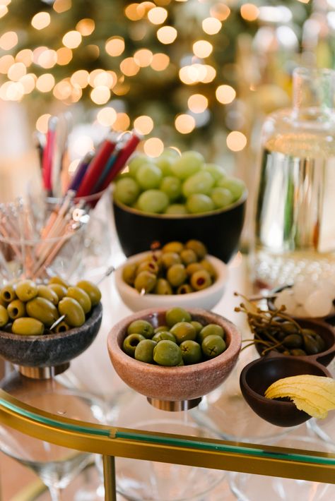 How to Set Up a Holiday Party Martini Bar - Front + Main Make Your Own Martini Bar Party Ideas, Martini Night Party, Holiday Party Bar Set Up, New Years Cocktail Party, Martini Station Party, Setting Up A Bar For A Party, Nye Martini, Small Cocktail Party Ideas, Martini Bar Set Up