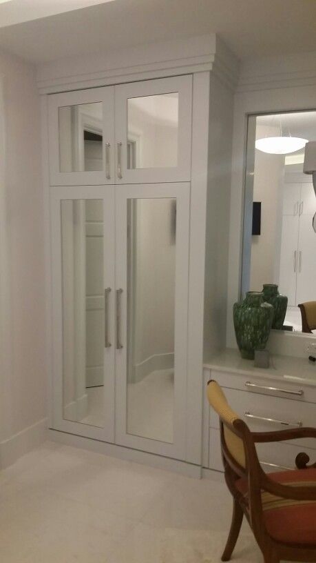 White painted cabinetry with mirrors inside the inset area of the door. Cupboard With Mirror, Almirah Design, Almirah Designs, Built In Cupboards, Study Ideas, Wardrobe Doors, Mirror Cabinets, Mirror Door, Built Ins