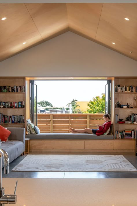 Lounge with built-in bench seat, bi-fold windows, girl reading a book Window Bench Living Room, Bifolding Windows, Kids Window Seat, Reading Nook Cozy Corner, Bedroom Bench Seat, Built In Bench Seating, Window Remodel, Window Bench Seat, Reading Nook Kids