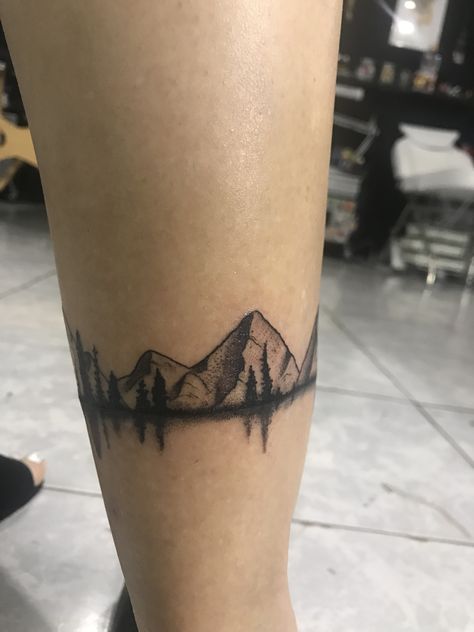 Mountain tattoo Moutain Tattoos, Ankle Tattoo Men, Berg Tattoo, Arm Wrap Tattoo, Tattoo Mountain, Grandma Tattoos, Wrap Around Tattoo, Wrap Tattoo, M Tattoos