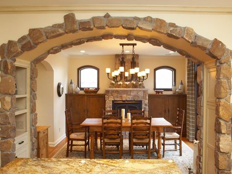 To give this formal dining room a more casual feel, designer Rachel Kate echoed the stone siding on the exterior of this Montana home on the arch of the interior space. Doorway Frame, Archways In Homes, Archway Decor, Arched Doorways, Stone Archway, Fireplace Stone, Cottage Dining Rooms, Modern House Interior, Storage Inspiration