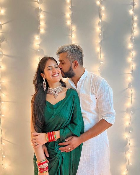 Couple pose idea. Male partner kissing the forehead of his partner and girl smiling with eyes close while facing the camera. Diwali Couple Photography Poses Traditional, Diwali Photo Shoot For Couple, Diwali Pictures Couple, Diwali Photoshoot Ideas For Couple, Diwali Cupal Photo, Diwali Photography Couple, Couple Poses Diwali, Couple Pose In Sari, Couple Pose In Saree And Kurta