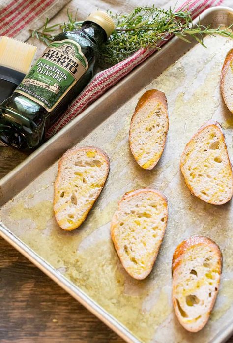 Toasting baguette slices in the oven for goat cheese mushroom toasts Toasting Baguette In Oven, Pizza Stone Recipes, Pampered Chef Pizza Stone, Cheesy Croutons, Baguette Slices, Making Pizza, Cooking Stone, Crostini Recipes, Truffle Butter