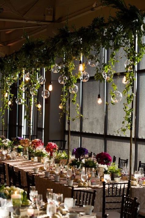 Wedding lighting ideas - Hanging light bulbs at wedding reception #weddingdecor #weddingdecorations #hanginglightbulbs #fairylights Balloons Hanging From Ceiling Wedding, Unique Floral Centerpieces Wedding, Big Light Bulb Decor, Hanging Vines Wedding Decor, Hanging Vines With Lights, Over Table Hanging Decorations, Wedding Decorations Tropical, Vines Hanging, Hanging Greenery