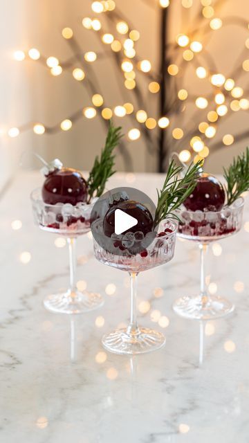 23K views · 1.1K likes | Carol & Ale on Instagram: "Ornament Mocktail ✨ such a cute drink idea for your friends & family this Holiday season!

Add ice to a coupe glass (used an ice tray that makes these super cute ice spheres), add pomegranate seeds and rosemary. Add the cranberry juice to an empty ornament and place it on top of the ice!

Make it boozy by adding vodka to the cranberry juice, or make it sweeter by using a mix of sweetened pineapple and cranberry juice! 

Comment LINKS and I’ll send you the links to shop everything we used!

#holidaycocktails #holidaycocktail #christmasdrinks #wintercocktails #christmascocktails #holidayrecipes #holidayideas #holidayentertaining #holidayhacks #winterrecipes #mocktailrecipe #mocktailrecipes" Pineapple And Cranberry Juice, Winter Cocktails, Cocktail Mix, Mocktail Recipe, Christmas Cocktails, Pomegranate Seeds, Holiday Cocktails, Cranberry Juice, Holiday Drinks