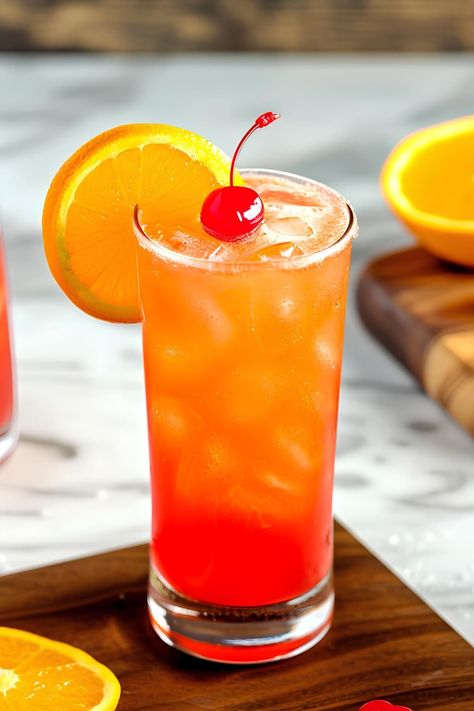 Dive into the world of classic cocktails with this Alabama Slammer cocktail recipe. It's a Southern-inspired summer drink with a stunning sunset hue. Alabama Slammer Recipe, Malibu Sunrise Cocktail, Malibu Sunset Cocktail, Alabama Slammer Drink, Sunset Cocktail Recipe, Alabama Slammer, Alabama Orange Beach, Sunset Drink, Gin Liqueur