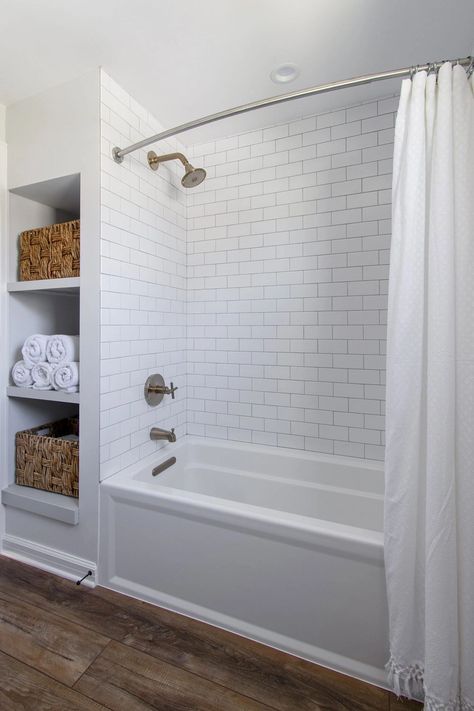 Subway Tile Bathroom Wood Floor, Tiled Bathroom Floors And Showers, Tub Shower Combo Remodel Diy, Bathtub With Subway Tile, Bathtub Subway Tile Surround, Subway Tile Shower With Tub, Classic Guest Bathroom Ideas, Tub With Herringbone Tile Walls, White Tub Tile Surround