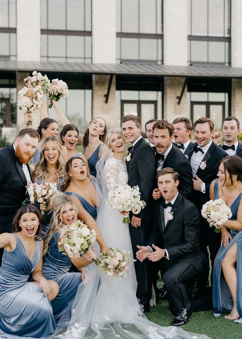 fun wedding party on wedding day at Omni Barton Creek Blue Tux Bridal Party, Blue Wedding Photography, Steel Blue And Black Wedding, Black Tuxedo With Dusty Blue, Dusty Blue Black And Gold Wedding, Light Blue Velvet Bridesmaid Dresses, French Blue And Black Wedding, Blue Bridesmaid Black Groomsmen, Dusty Blue Bridesmaid Dresses And Black Suits