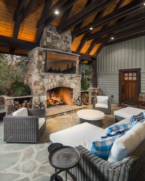 25 Cozy Covered Patios and Porches With Fire Features Pavilion With Fireplace, Patio With Fireplace, White Wood Paneling, Stone Fireplace Surround, Porch Fireplace, Covered Patios, Fire Pit Sets, Enclosed Porches, Outdoor Fireplaces