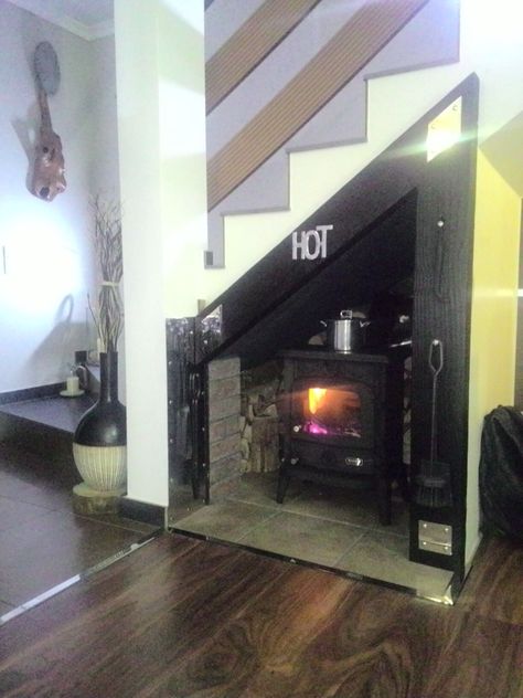 Wood stove under the stairs!!? Why not...? Fireplace Under The Stairs, Under Stairs Fireplace, Wood Stove Under Stairs, Fireplace Under Stairs, Fire Places Ideas, Ideas Under Stairs, Wyoming Cabin, White Stair Risers, Pallet Stairs