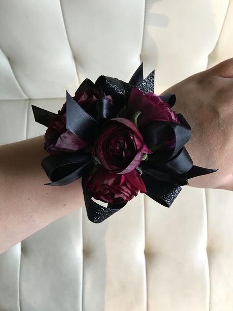 Pomp&Bloom dark burgundy and black corsage Prom Corsage And Boutonniere Burgundy, Red Black Corsage, Red And Black Wrist Corsage Prom, Black And Maroon Corsage, Corsages For Prom Burgundy, Gothic Corsage Prom, Emo Corsage, Burgundy Corsage Prom, Dark Red Corsage And Boutonniere