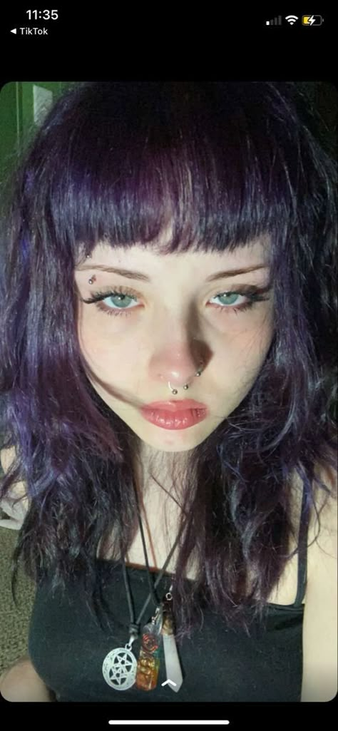 Dark Purple Hair Green Eyes, Purple Hair With Bangs Aesthetic, Dark Purple Hair Grunge, Purple Egirl Hair, Purple Black Hair Short, Black And Purple Color Block Hair, Dark Purple Hair Blue Eyes, Black Purple Hair Short, Black And Purple Shag Hair