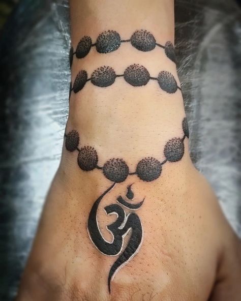 Wrist band tattoo ,om tattoo Mala Beads Tattoo, Om Rudraksha Tattoo, Rudraksha Band Tattoo, Om Band Tattoo, Rudraksh Tattoo Design, Rudraksha Tattoo Design, Rudraksha Tattoo, Rudraksh Tattoo, Jewelry Tattoo Designs