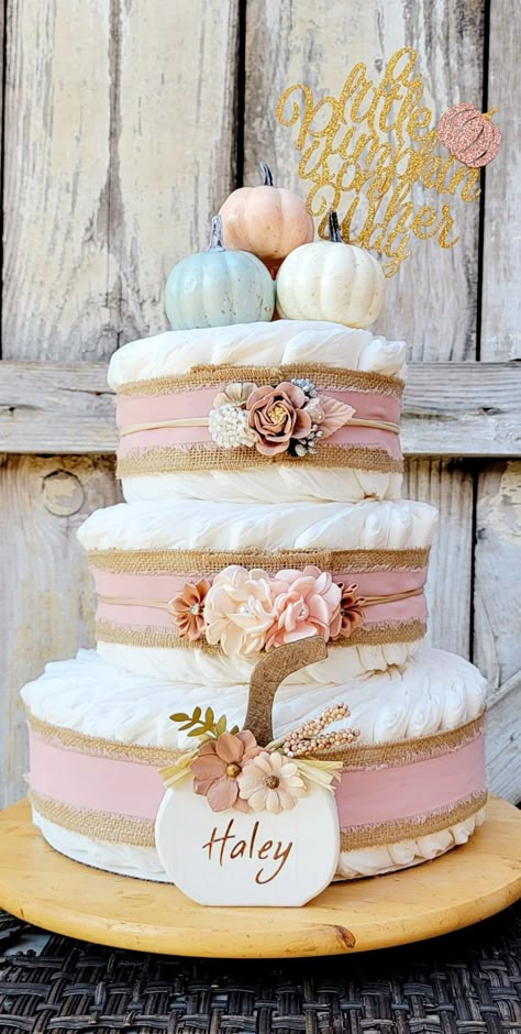 Fall Candy Bar Ideas, Diaper Cake Pumpkin Theme, Pink Pumpkin Shower Ideas, Baby Girl Baby Shower Themes Fall, Fall Baby Shower Diaper Cakes, Pink Pumpkin Baby Shower Centerpieces, Fall Pink Baby Shower Ideas, Diaper Cake Fall Theme, Pink Fall Themed Baby Shower Ideas