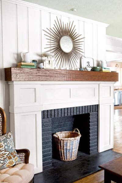 A fireplace should steal the show in a living room, not drag it down. At Kevin and Layla Palmer's 1950s home, in Prattville, Alabama, the gathering space's dreary gray fireplace was more homely than homey. And once the room's knotty-pine walls got a much-needed coat of cream-colored paint and the wall-to-wall carpet was pulled up to reveal warm oak floors, the fireplace became even more of an eyesore. Learn how the homeowners doctored up the existing mantel with this rustic new ma... Fireplace Facing, Fireplace Redo, Brick Hearth, Painted Brick Fireplaces, Fake Fireplace, Fireplace Update, Серая Кухня, Wood Mantle, Old Fireplace