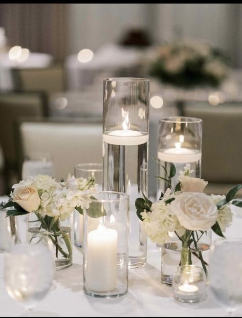 Simple Classy Centerpieces, Candle In Vase Centerpiece, Candles Centrepiece Wedding, Candle And White Flower Centerpiece, 3 Candle Centerpiece, Candles On Table Wedding, Candle Floral Centerpieces, Boho Candle Centerpieces, Simple Wedding Centrepiece