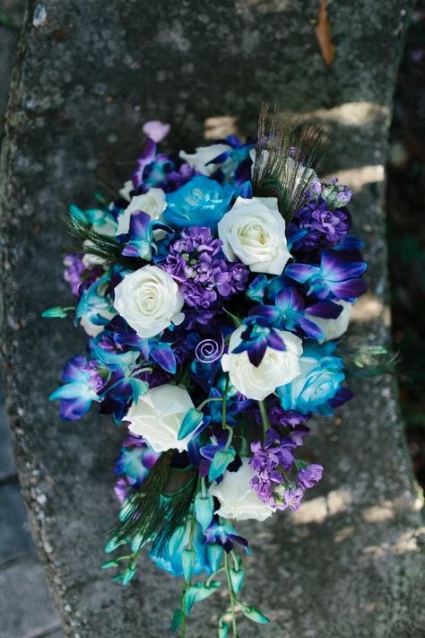 Peacock bouquet photography Regalo Wedding bouquet roses blue bomb orchids purple blue and ivory Peacock Wedding Flowers, Blue Purple Wedding, Galaxy Wedding, Green Wedding Flowers, Bouquet Photography, Purple Wedding Theme, Blue Wedding Bouquet, Blue And Purple Flowers, Boda Mexicana