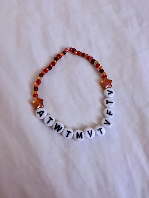 Orange Eras Tour Bracelet, All Too Well Bracelet Taylor Swift, Unhinged Eras Tour Bracelet Ideas, Eras Tour Bracelets Folklore, Bejeweled Taylor Swift Bracelet, Atwtmvtvftv Bracelet, All Too Well Friendship Bracelet, Speak Now Bracelet Taylor Swift, Red Friendship Bracelet Taylor Swift