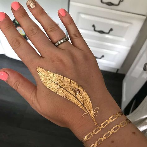 Which Gold Tattoo Design Should I Go For 8 Gold Leaf Tattoo, Metallic Tattoo Permanent, Gold Ink Tattoo Permanent, Gold Tattoo Permanent, Gold Tattoo Ink Permanent, Yellow Ink Tattoos, Gold Ink Tattoo, What Colors Make Gold, Black And Gold Tattoo