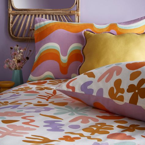 Fun, funky and retro-inspired, the cheerful Amelie duvet cover set features bright, abstract florals in boldly colored geometric shapes, printed on a fresh white background. This uplifting and retro story celebrates unique styling and the freedom to express yourself. On the reverse, wavy lines and icons get a cheeky twist with bold and high-contrast looks, outlined by the rich mauve tone. Ideal for those who love to add a splash of fun and color to their bedroom. Size: 137cm W x 200cm L Duvet Covers Dunelm, Retro Bedding, Colorful Duvet Covers, Retro Bed, Floral Bedding Sets, Accent Chair Bedroom, Corner Sofa Chaise, Tv Beds, Floral Duvet Cover