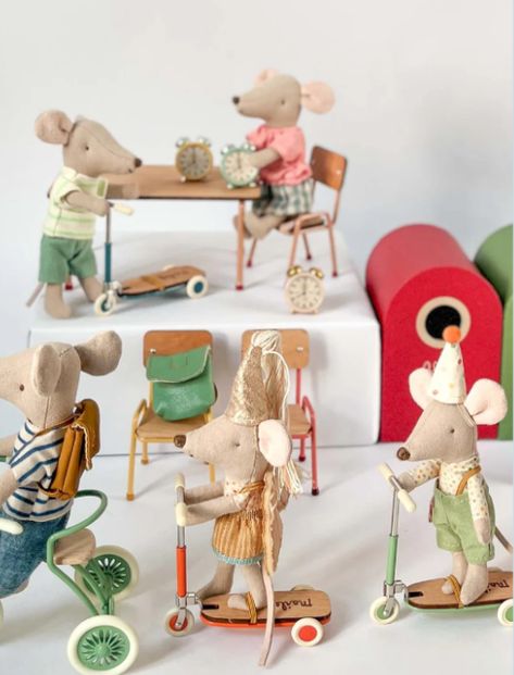 Step into the whimsical world of Maileg with these charming mice enjoying a fun-filled day! From scooting around on tiny wooden scooters to school-time moments with backpacks and clocks, this beautifully detailed miniature scene is perfect for collectors and imaginative play. Featuring Maileg's signature vintage-inspired design, this setup adds a magical touch to any nursery or playroom. Save this for your dollhouse inspiration or gift ideas! 🐭✨ #MailegWorld #MiniatureMagic #DollhouseDecor #WhimsicalToys #MailegMice Wooden Scooter, Maileg Mice, Maileg Mouse, Dollhouse Inspiration, Magical Things, Dollhouse Decor, School Time, Vintage Inspired Design, Imaginative Play