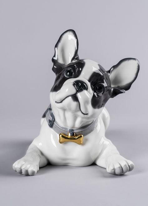 Height (in) 9.449 Width (in) 11.417 Length (in) 13.78 Porcelain Type Gloss Sculptor Raul Rubio Finished in a combination of gloss and matt, this piece is decorated with soft pastel tones, except for the intense black of the black spots of the bulldog that gives it contrast and the touch of golden brightness of the ornament worn on the necklace. Perfect for giving, collecting or decorating, made in Spain by Lladró’s expert artisans. #lladro #FrenchBulldog #bulldog #macarons #handcrafted #porcel Dog Candy, Toy Bulldog, French Bulldog Gifts, Lladro Porcelain, Candy Collection, Lladro Figurines, Bulldog Gifts, Bronze Figurine, French Bull