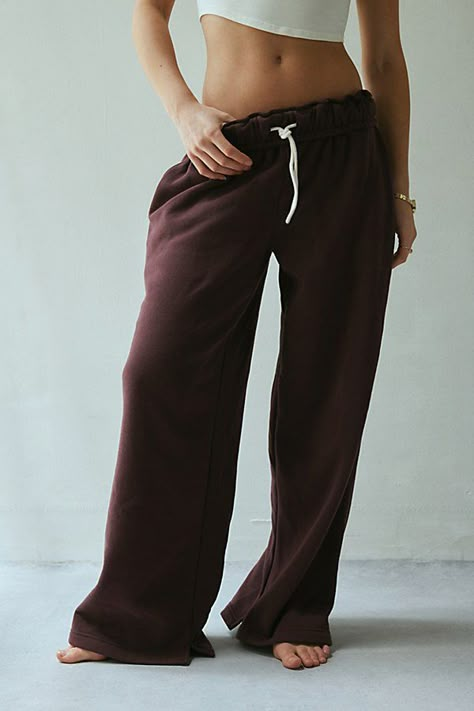 Out From Under sweatpant made special with piping details. Designed in a relaxed wide-leg silhouette featuring a ruffled elastic waistband with drawstring tie, side pockets and split hems. Exclusively at Urban Outfitters. Features Out From Under Hoxton piping wide leg sweatpant Wide leg sweatpant Soft and stretchy knit Ruffled elastic waistline with drawstring tie Side pockets with contrast piping down the sides Split hems Relaxed wide-leg fit Full length Easy pull-on style UO exclusive Content Gifts For Boyfriend Clothes, Proclub Sweats, Staple Clothing Pieces, Cool Sweatpants, Clothes To Buy, Brown Sweatpants, Fall Bottoms, Cute Online Clothing Stores, Fall Basics