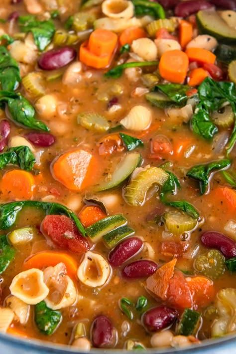 This Minestrone Soup tastes just like the Olive Garden's so there's no need to leave the house! Fresh vegetables, tender noodles, rich spices, and parmesan make this soup very hearty and flavorful. Plus, it's an easy soup to make and it can be ready in under an hour! Copy Cat Olive Garden Ministroni Soup, Vegetarian Minestrone Soup Crockpot, Soup Recipes Veggie, Olive Garden Minestrone Soup Crockpot, Vegetable Noodle Soup Recipes, No Food In The House Recipes, Olive Garden Minestrone Soup Recipe, Copycat Olive Garden Minestrone Soup, International Soups