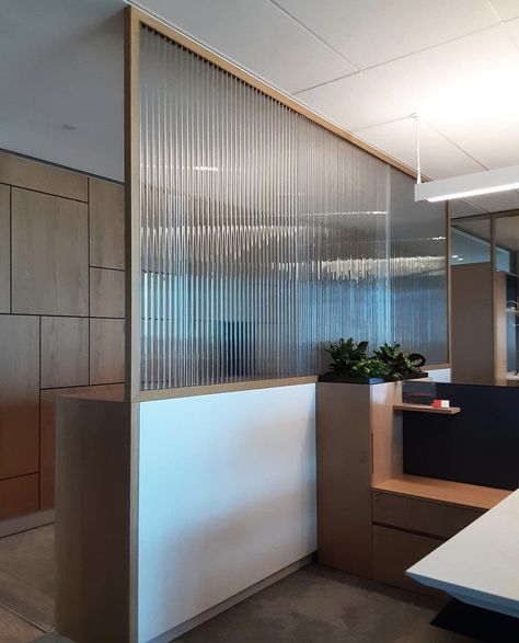 Featuring stunning translucent kiln-formed partitions by Nathan Allan, made with 10mm crystal clear Cathedral Glass. Stay tuned for more!  #glass #design #interiordesign #architecture #luxury #castglass #dividers #architecturalglass #artglass #glasswall #glassart #officedesign #office #officespace #partitions #walls #facades #healthcaredesign #retaildesign #hospitals #residential #hotels #hospitality #construction #retail #fluted #homedesign #flutedglass #thickglass Office Partition Design, Office Partitions Wall, Glass Partition Designs, Office Cabin Design, Glass Office Partitions, Modern Partition Walls, Wall Partition Design, Contemporary Office Design, Office Dividers