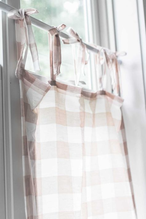 Learn how to make DIY cafe curtains with this easy tutorial. Transform your window, giving it a little bit of privacy while also allowing the light to filter through, with these simple tie-top curtains. #farmhouseonboone #cafecurtain #diycafecurtain #diycurtins Diy Cafe Curtains, Homestead Farmhouse, Farmhouse On A Budget, Tie Top Curtains, Farmhouse On Boone, Curtain Tutorial, Farmhouse Projects, Tie Tops, Small Curtains